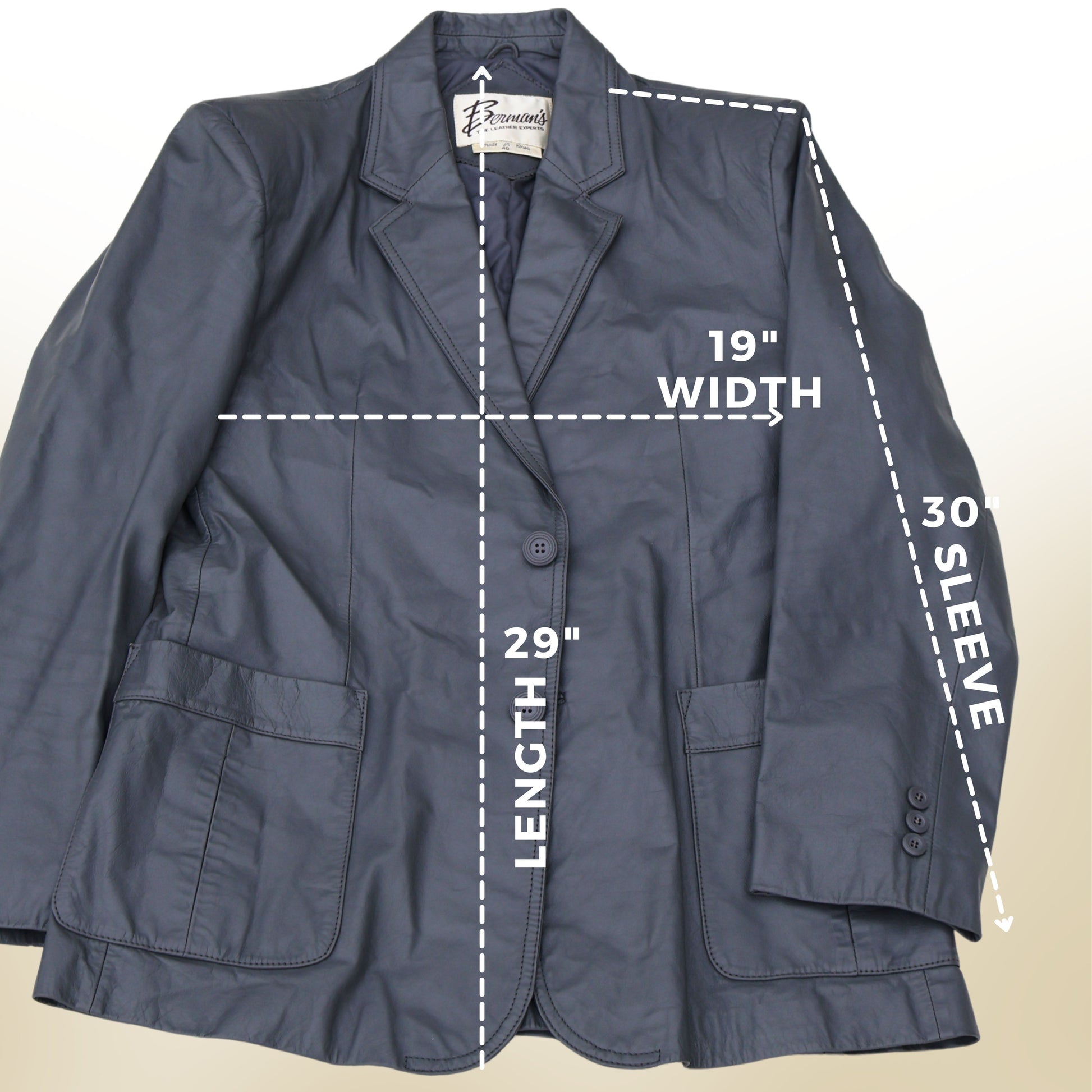 Measurement diagram of vintage gray leather blazer showing 26 inch width 30 inch length and 33 inch sleeve.