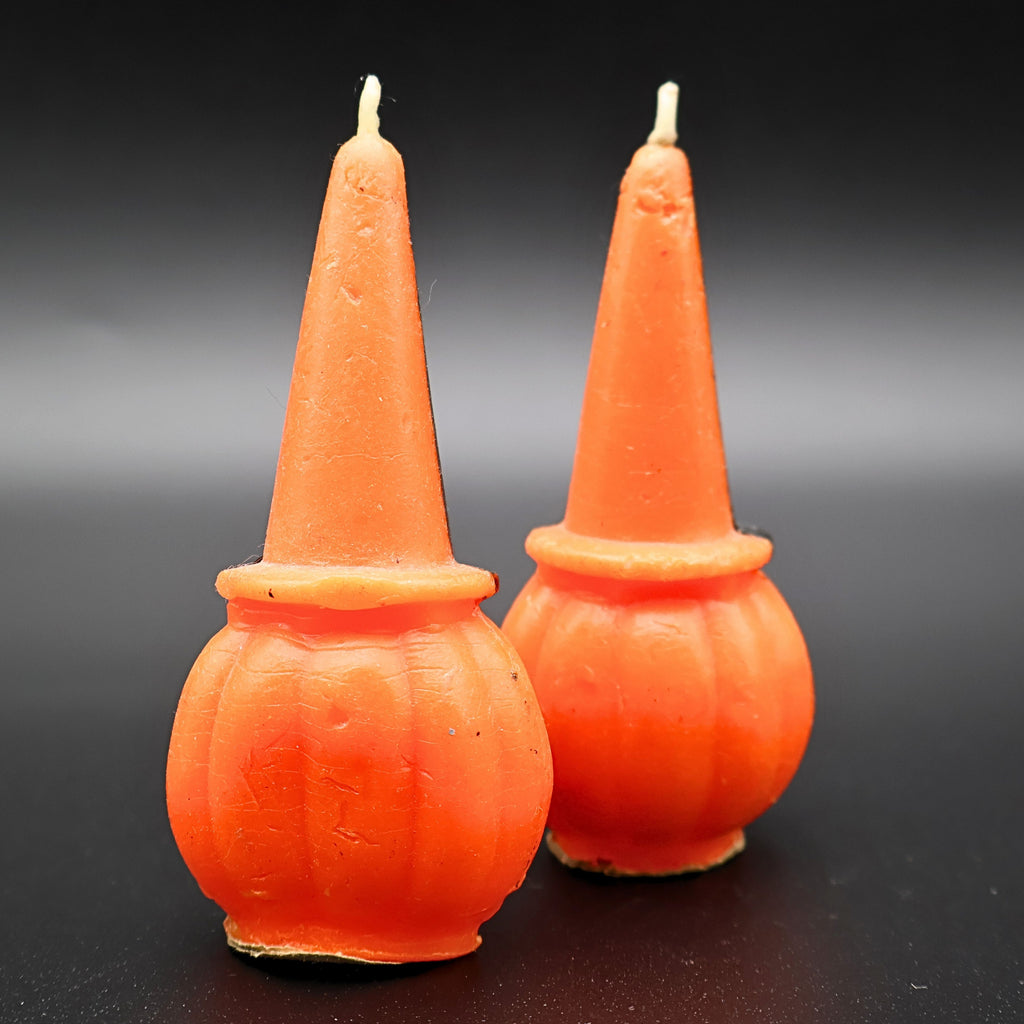 Back view of vintage Gurley pumpkin candle set showing shape and condition of both candles