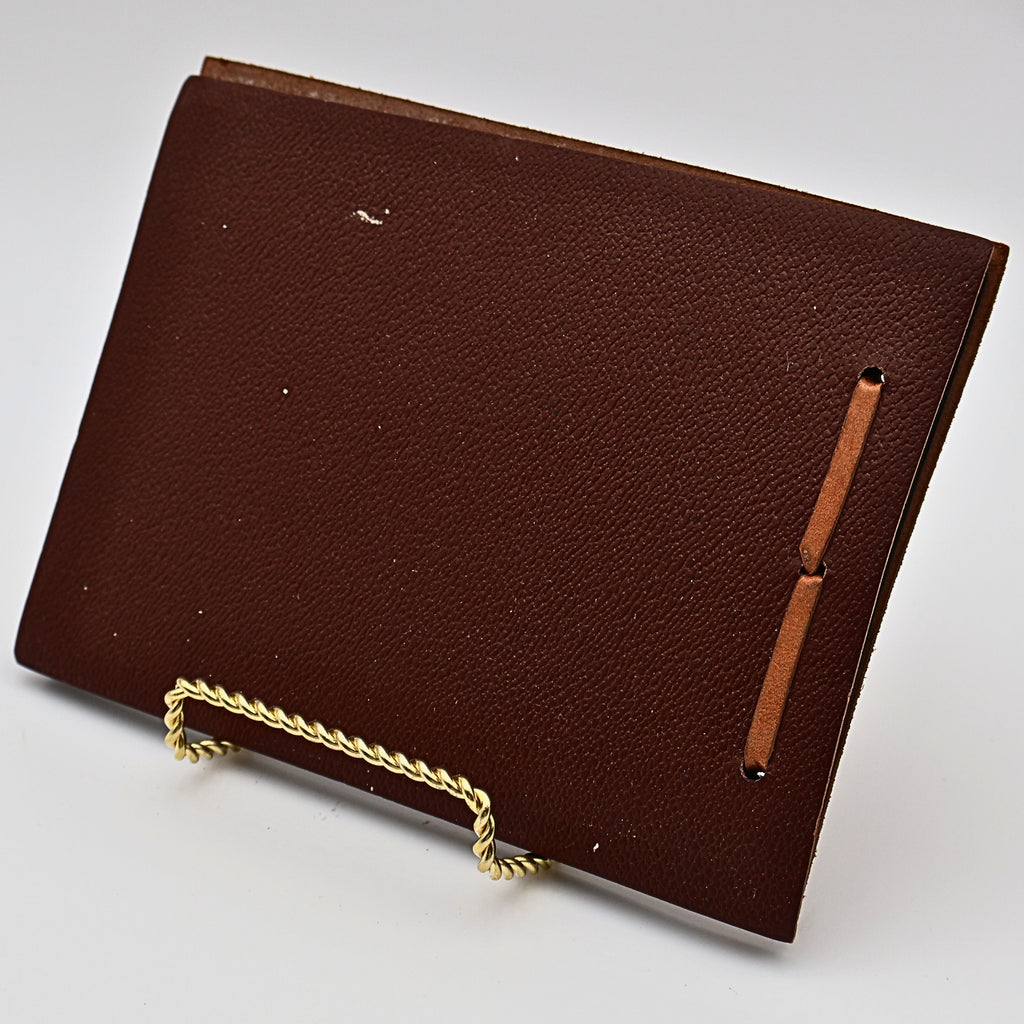 Back cover of vintage leather Snap Shots photo album