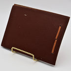 Back cover of vintage leather Snap Shots photo album