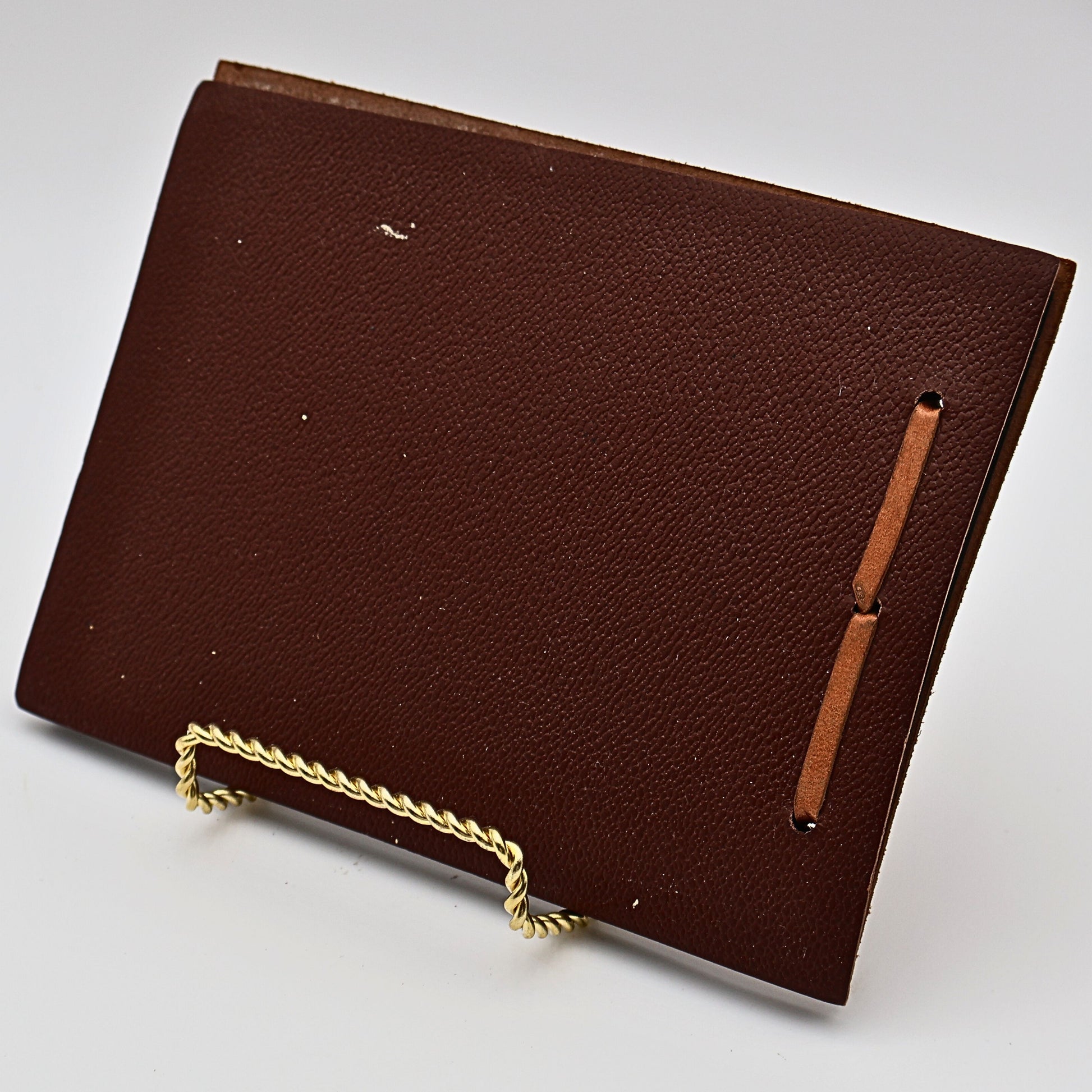 Back cover of vintage leather Snap Shots photo album