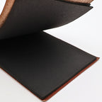 Interior pages of Snap Shots leather-bound photo album