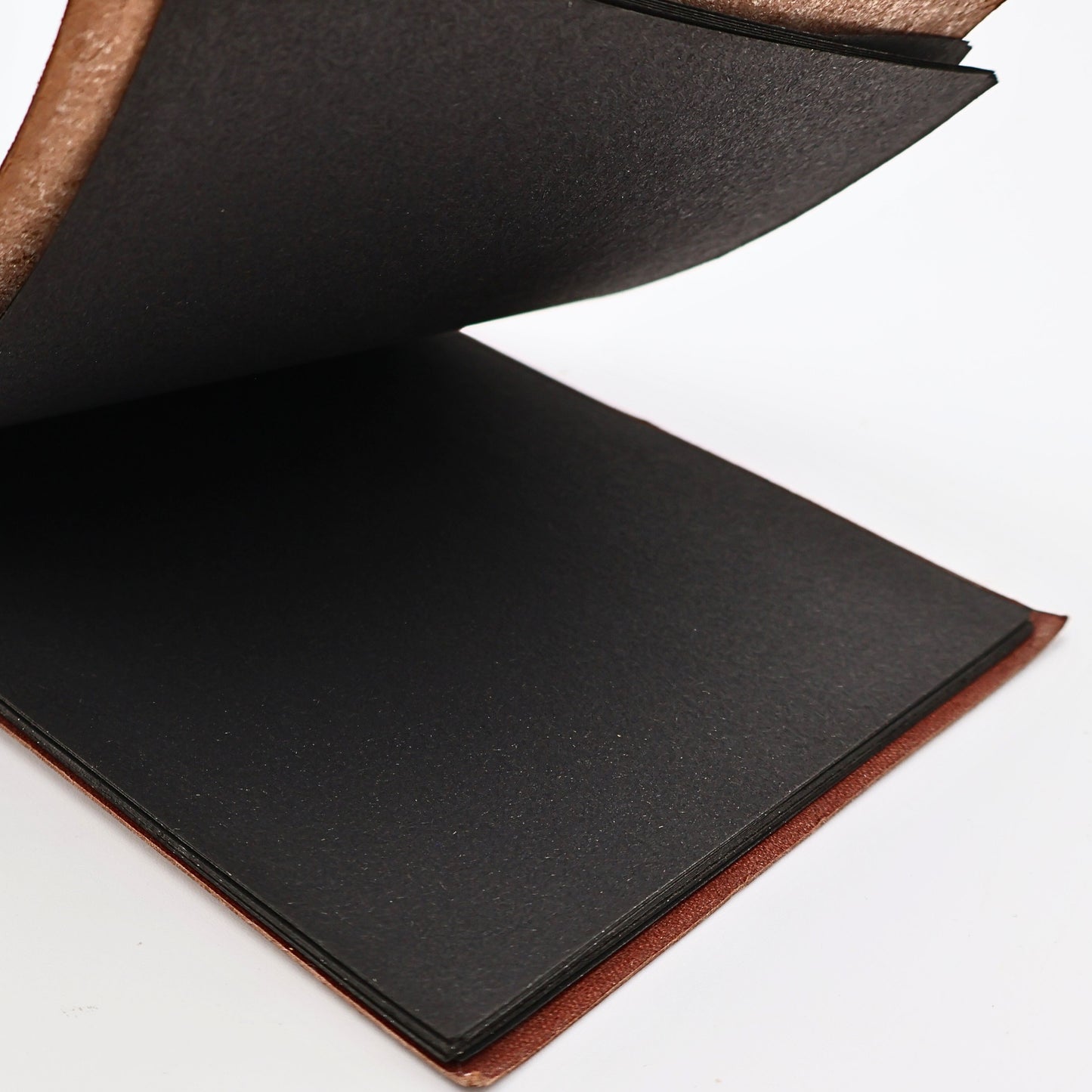 Interior pages of Snap Shots leather-bound photo album