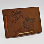 Front cover of vintage leather Snap Shots photo album