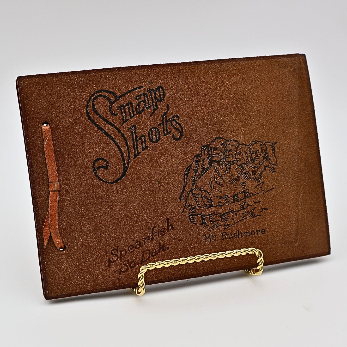 Front cover of vintage leather Snap Shots photo album