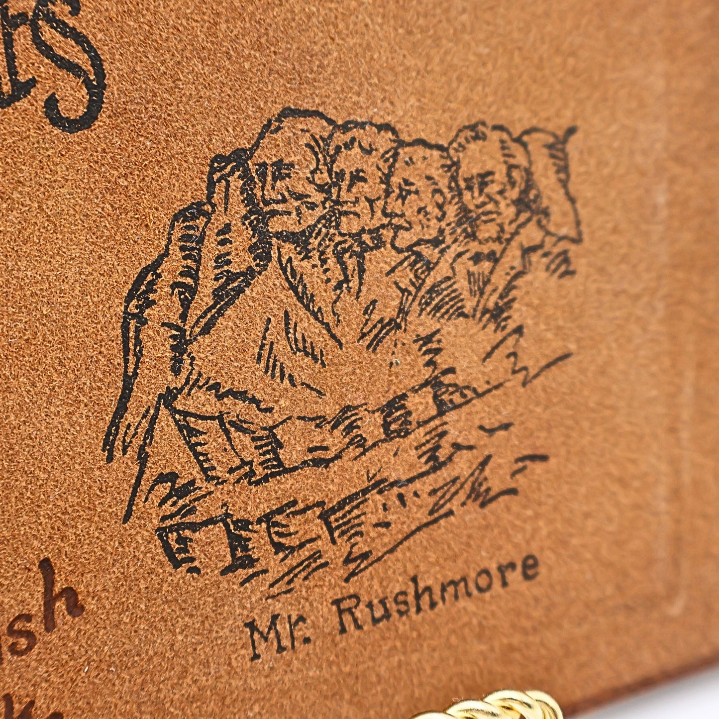 Mount Rushmore stamped artwork on vintage leather photo album