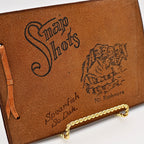 Vintage leather "Snap Shots" photo album with Mount Rushmore stamped cover
