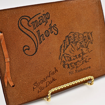 Vintage leather "Snap Shots" photo album with Mount Rushmore stamped cover