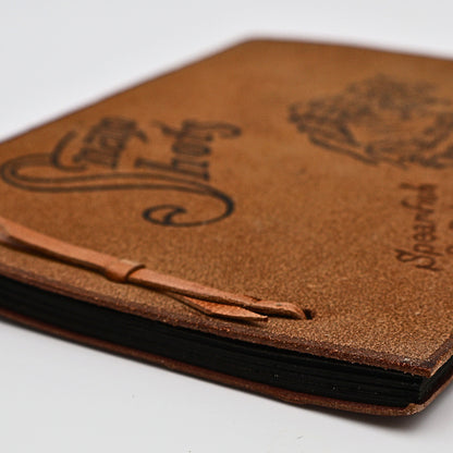 Side view and binding of vintage leather Snap Shots photo album