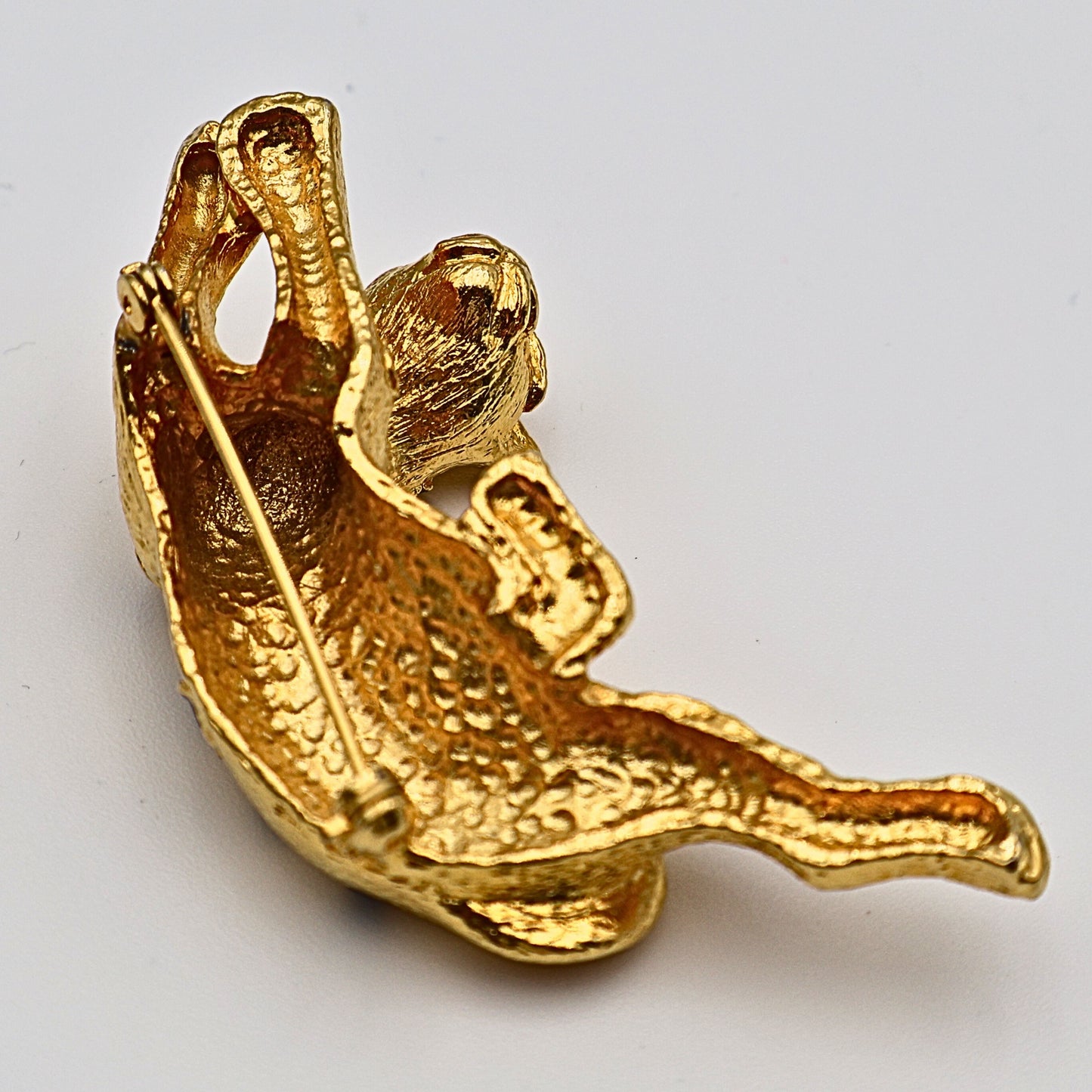 Back of vintage leopard brooch pin with secure pin-back closure