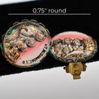 Low profile view of both vintage Mount Rushmore clip-on earrings emphasizing the rounded domed tops, sculpted presidential relief, and decorative gold-tone scalloped edges. The image showcases the three-dimensional character and nostalgic design of these collectible travel souvenirs.