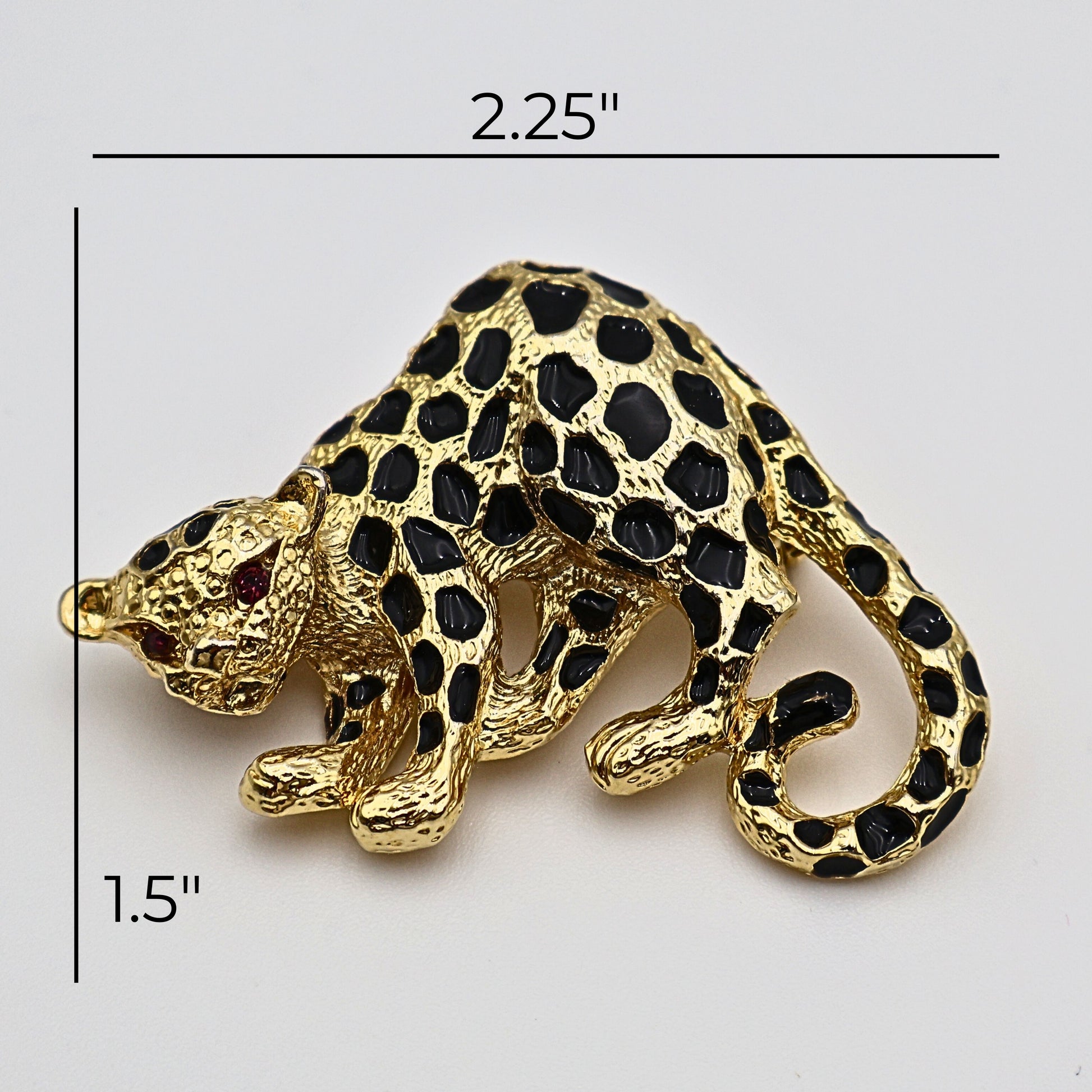 Size view of vintage Park Lane cheetah brooch showing sculptural gold body and enamel detailing