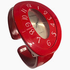 Vintage red cuff watch Rumours 29978 bracelet watch with chunky retro design and quartz movement, bold 90s statement jewelry accessory for women styled at an angle