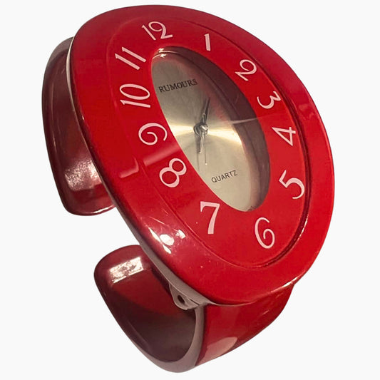 Vintage red cuff watch Rumours 29978 bracelet watch with chunky retro design and quartz movement, bold 90s statement jewelry accessory for women styled at an angle