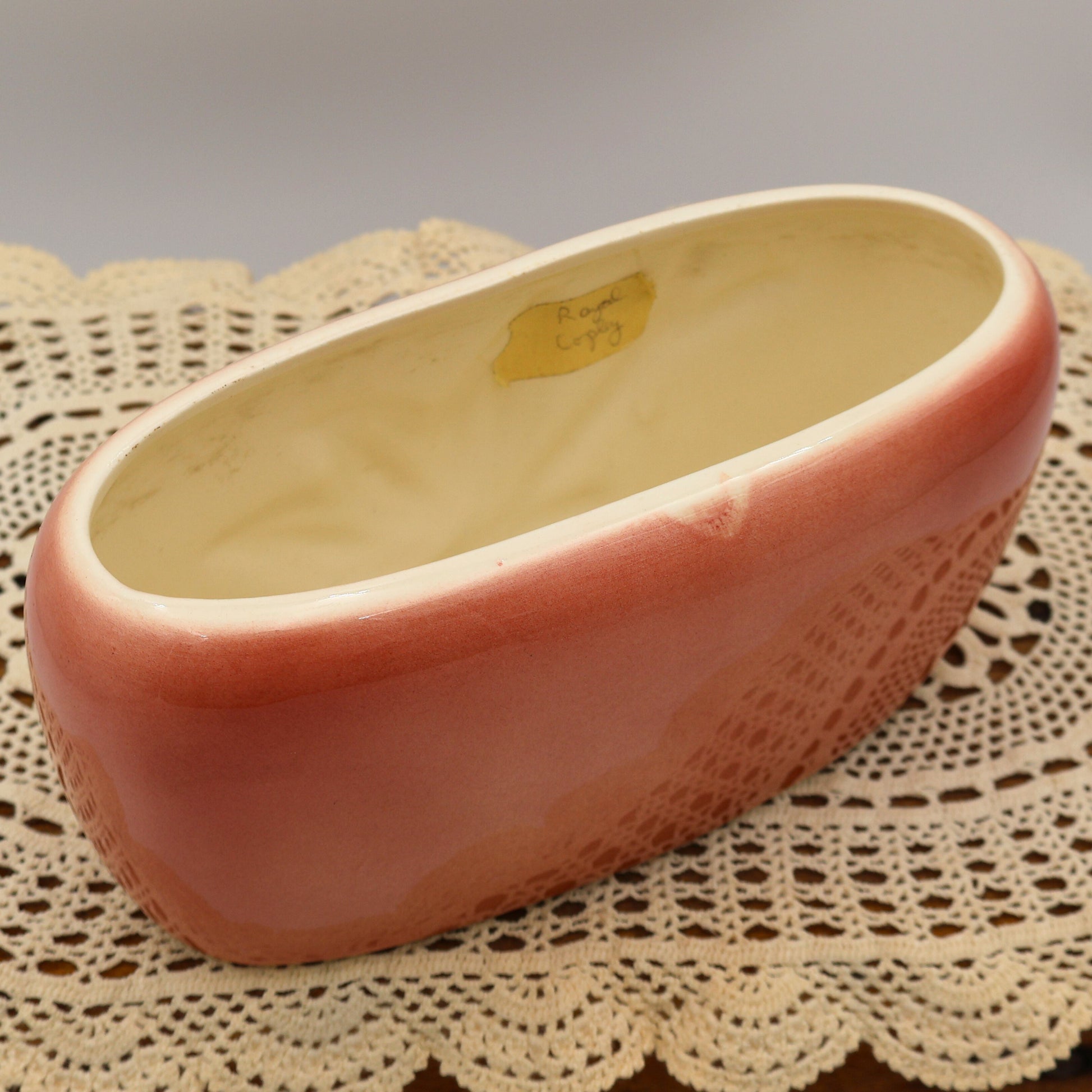 Interior view of Royal Copley mid-century planter showing cream glazed inside and original vintage label.