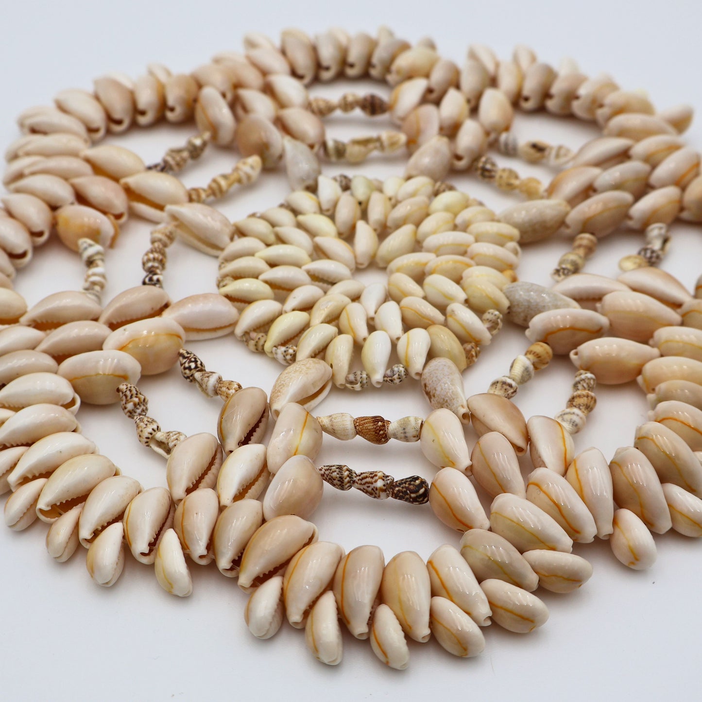 Side angle of handmade shell trivet showing depth and dimensional pattern