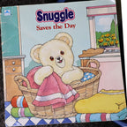 Vintage 1987 Snuggle Saves the Day storybook by Lever Brothers and Golden Books featuring the iconic Snuggle Bear on the illustrated front cover. Original advertising collectible in fair vintage condition, perfect for nostalgic laundry room decor, paper ephemera collections, and advertising memorabilia displays.
