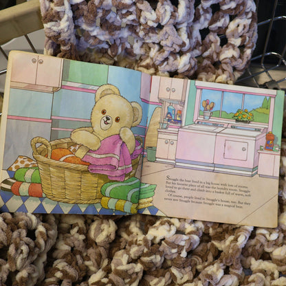 Interior pages of the vintage 1987 Snuggle Saves the Day storybook featuring the beloved Snuggle Bear in a colorful laundry room scene. Original Lever Brothers advertising collectible with charming illustrations that celebrate classic household brand nostalgia and vintage paper ephemera.