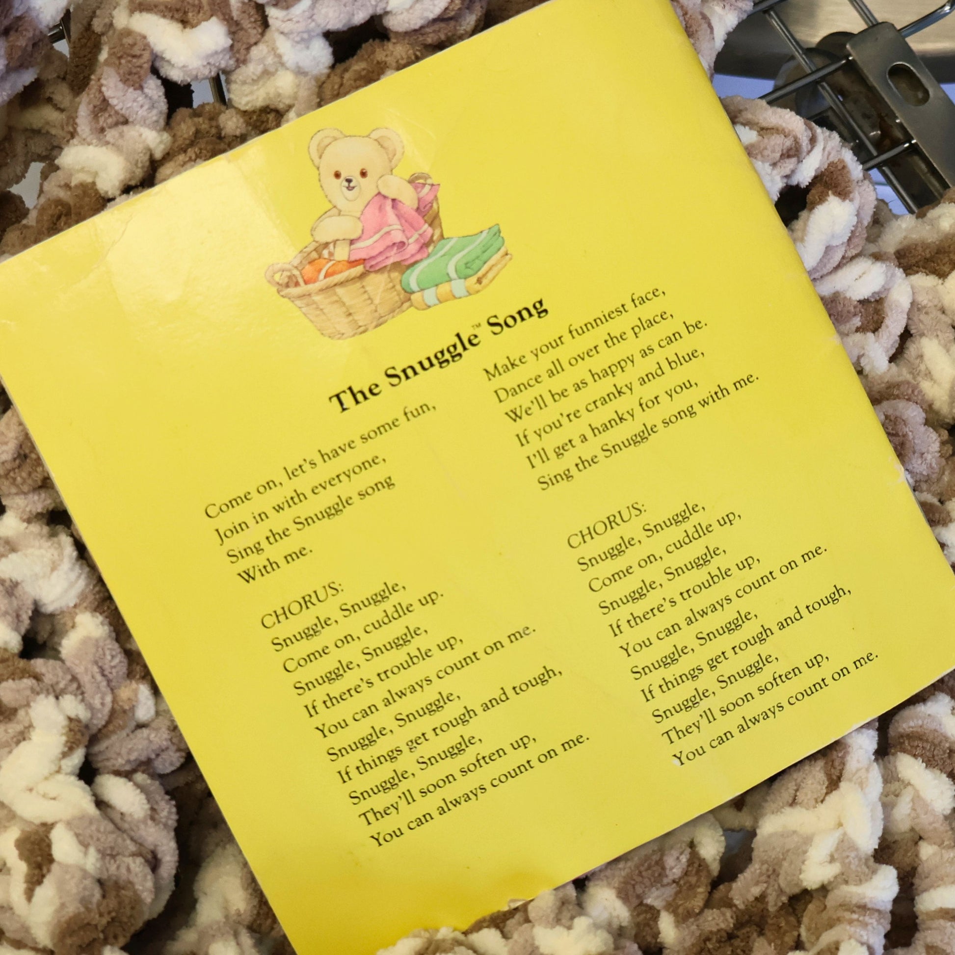 Back page of the vintage Snuggle Saves the Day storybook featuring the original Snuggle Song lyrics and illustration. A nostalgic piece of Lever Brothers advertising history preserved in this collectible Golden Books promotional publication from 1987.