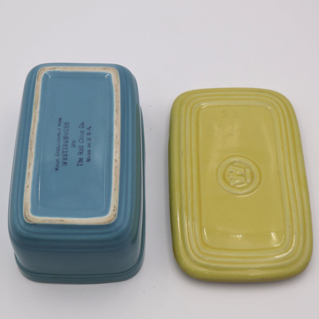 Bottom view of vintage Hall China refrigerator dish and matching yellow lid, Westinghouse promotional kitchenware.