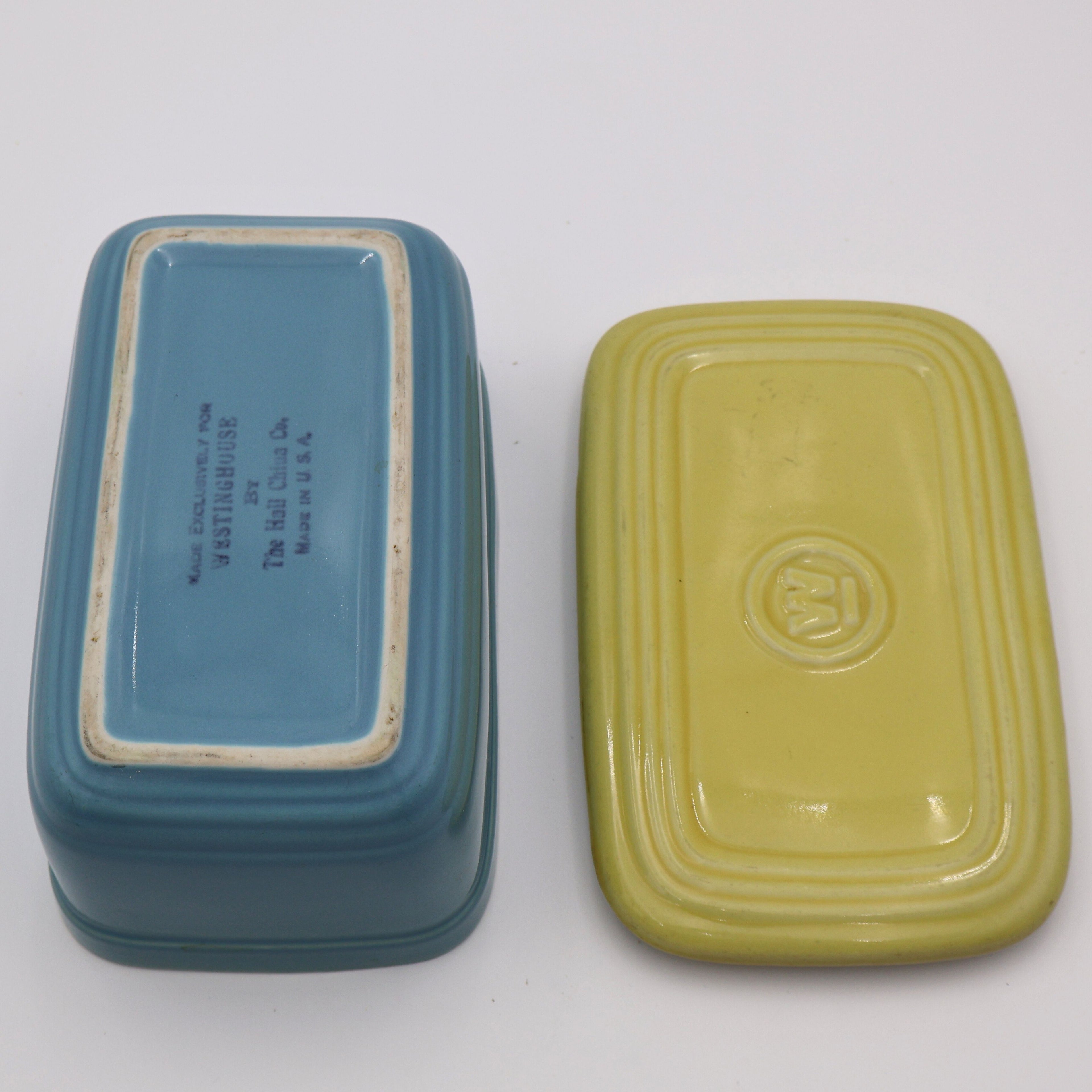 Bottom view of vintage Hall China refrigerator dish and matching yellow lid, Westinghouse promotional kitchenware.