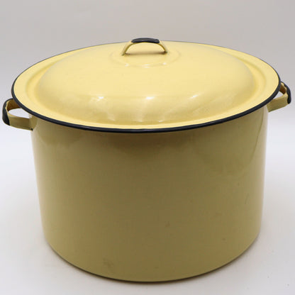 Vintage yellow enamelware stock pot with matching lid featuring a buttery yellow porcelain enamel finish, black rolled rim, and sturdy side handles. This large farmhouse kitchen collectible is perfect for cottagecore decor, rustic homes, and vintage kitchen styling.