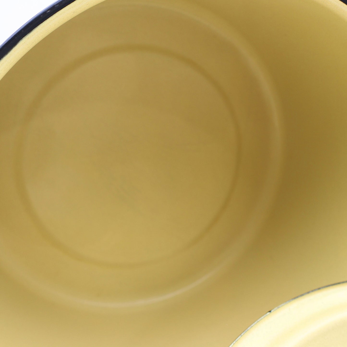 Interior view of a vintage yellow enamelware stock pot highlighting the smooth enamel-coated cooking surface and classic mid-century design. Perfect for farmhouse kitchens, country home decor, vintage displays, and collectible cookware.