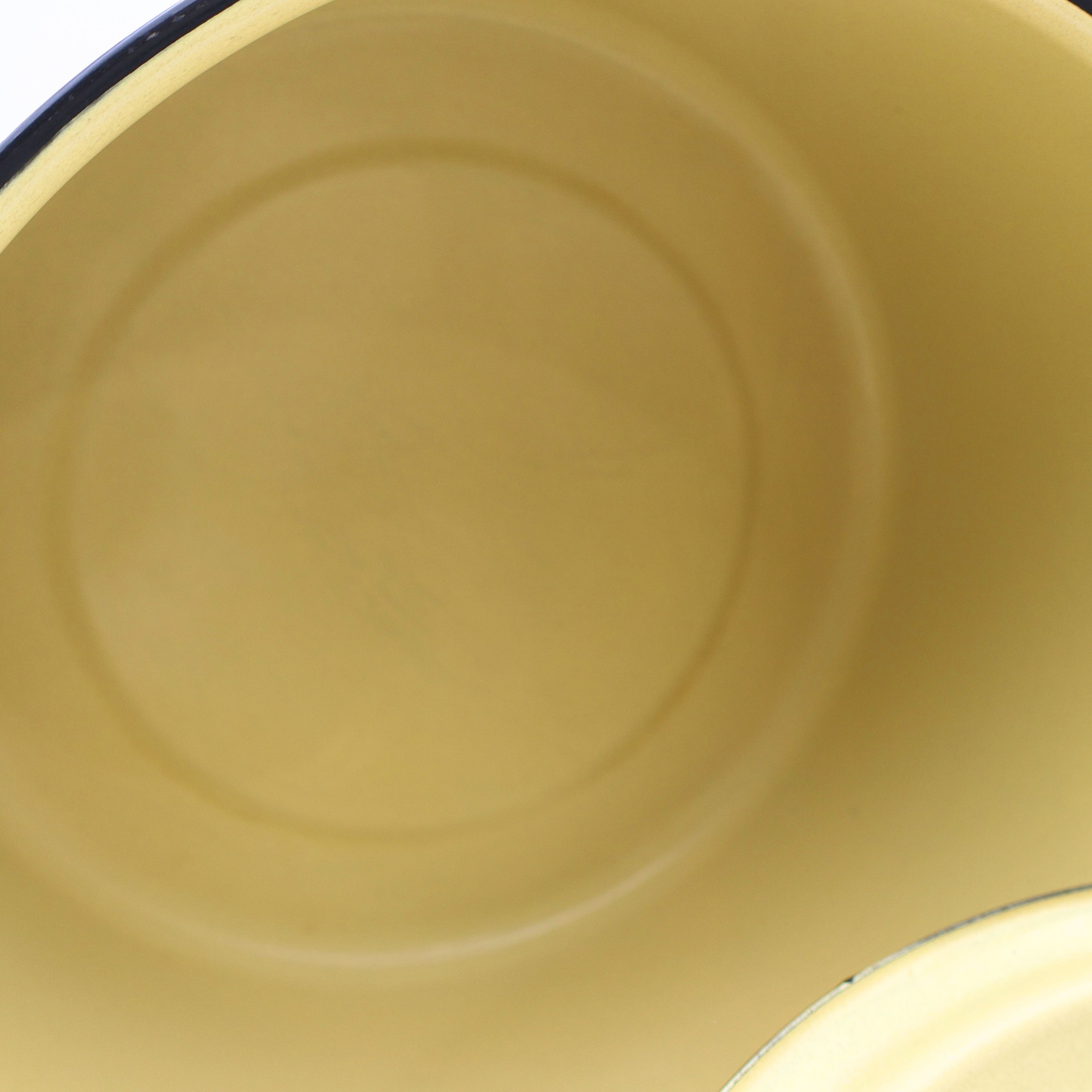 Interior view of a vintage yellow enamelware stock pot highlighting the smooth enamel-coated cooking surface and classic mid-century design. Perfect for farmhouse kitchens, country home decor, vintage displays, and collectible cookware.