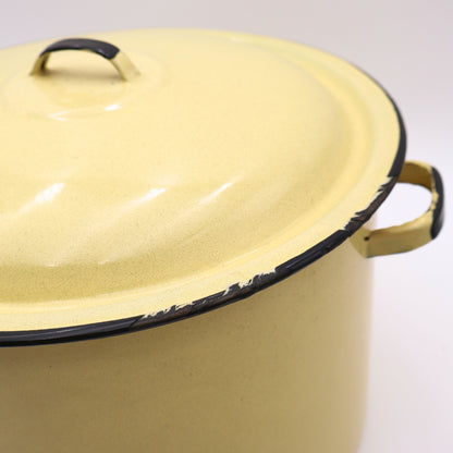 Close-up detail of the matching vintage yellow enamelware lid highlighting the glossy porcelain enamel finish, black rolled edge, and classic mid-century craftsmanship. A timeless farmhouse kitchen collectible with authentic vintage charm.