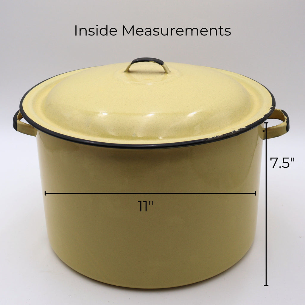 Vintage yellow enamelware stock pot shown with measurement reference displaying an approximate 11-inch diameter and 7.5-inch height. This large lidded farmhouse cookware piece makes a beautiful display in country kitchens, cottage homes, and vintage collections.