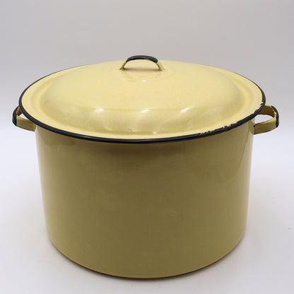Vintage yellow enamelware stock pot with matching lid featuring a soft buttery yellow finish, black rolled trim, and sturdy side handles. This large farmhouse kitchen pot is perfect for cottagecore decorating, rustic home decor, vintage cookware collections, and timeless kitchen styling.