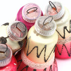 Closeup of original West Germany D.G.M.a ornament caps on vintage atomic mercury glass Christmas ornaments