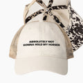 Cream western trucker hat with absolutely not gonna hold my horses embroidery and cow print longhorn undervisor detail