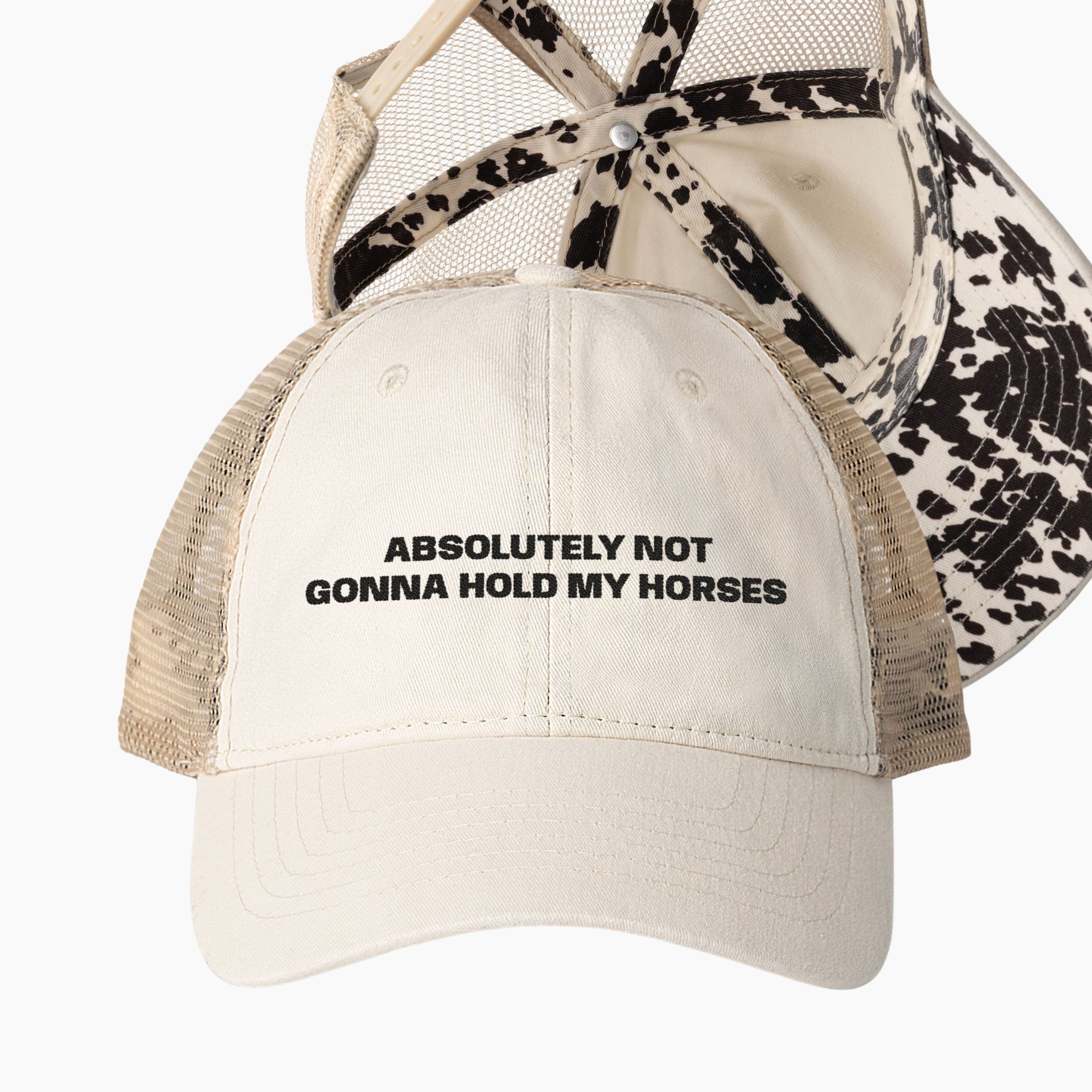 Cream western trucker hat with absolutely not gonna hold my horses embroidery and cow print longhorn undervisor detail