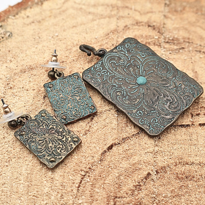 Backside view of Western longhorn jewelry set showing textured metal finish and construction details, turquoise patina earrings and pendant with engraved patterns and rustic finish, cowgirl jewelry set highlighting craftsmanship and durability, ideal for buyers wanting full detail of Western style accessories and Southwestern fashion pieces