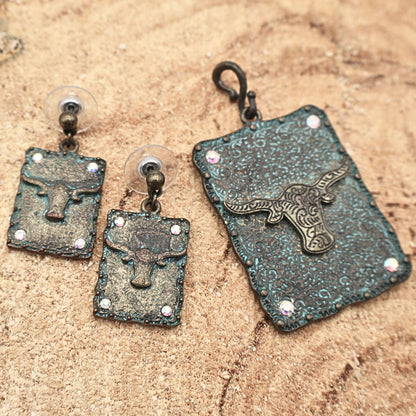 Western longhorn jewelry set featuring matching pendant and dangle earrings with turquoise patina finish and engraved concho detailing, rhinestone accents add subtle sparkle to this Southwestern cowgirl accessory set, rustic Western jewelry perfect for rodeo outfits, country concerts, and bold statement fashion styling