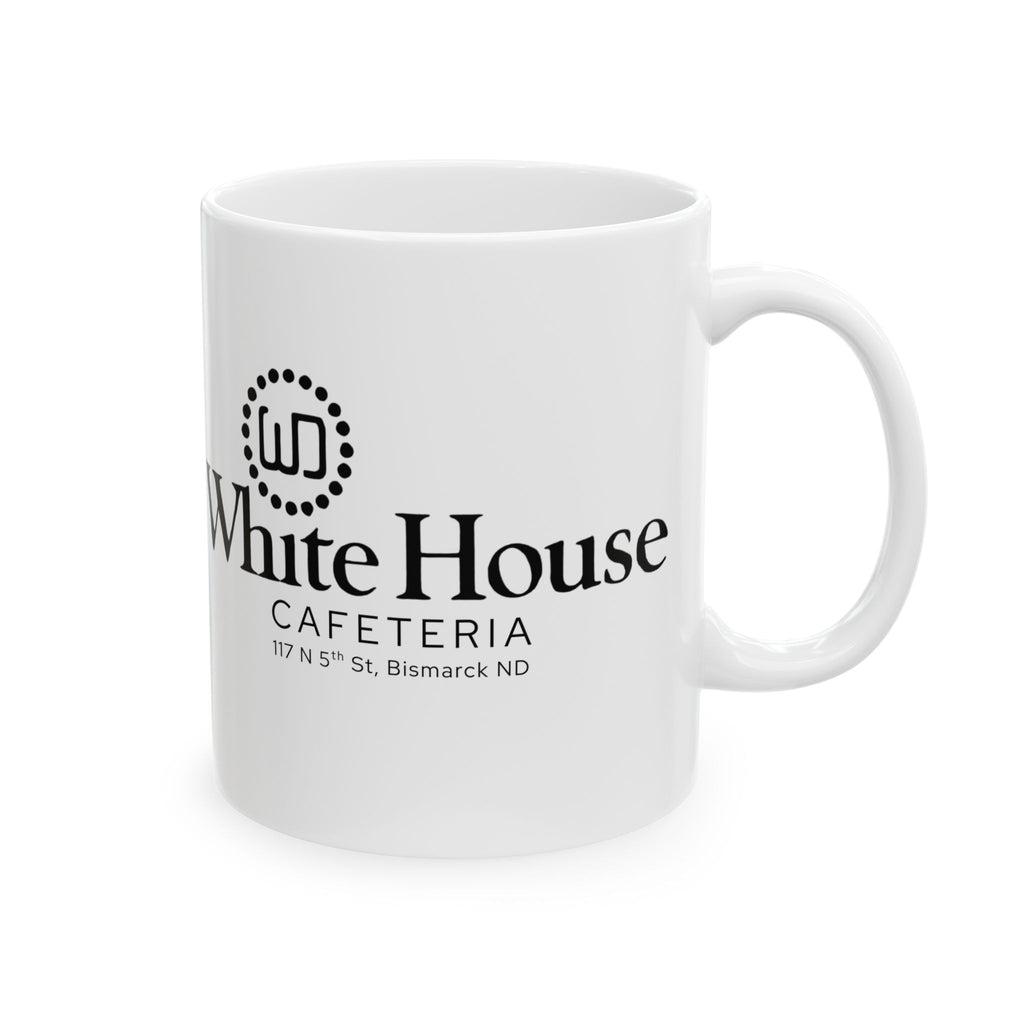 White ceramic coffee mug photographed with its handle on the right and the White House Cafeteria logo displayed in black. The design includes the restaurant's original 117 North 5th Street address in Bismarck, North Dakota.