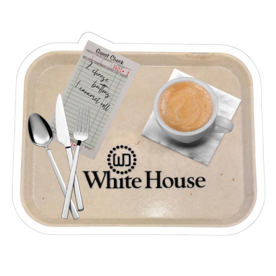 White die-cut sticker featuring a White House Cafeteria lunch tray with coffee, silverware and a handwritten guest check listing two cheese buttons and one caramel roll. The beige tray displays the familiar black cafe logo from the Bismarck restaurant.