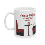 Illustrated side of a white ceramic mug featuring Cheese Buttons since 1968, Fridays only and if you know you know above maroon cafe booths, a black table with condiments and a sleepy black cat honoring owners Ken and Joan's beloved pet Jake.