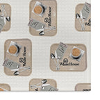 Close-up of the White House Cafeteria kitchen tea towel showing its soft woven texture and repeating light oatmeal tray pattern. Each tray features coffee, silverware, a handwritten Cheese Buttons and caramel roll guest check, and the White House logo.