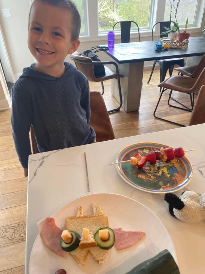 Young Oliver the Owl reader proudly shows his homemade owl sandwich from a kid-friendly recipe in the Oliver the Owl book series by children’s author Rayna Jo Zest, a reader-submitted photo of hands-on family cooking fun.