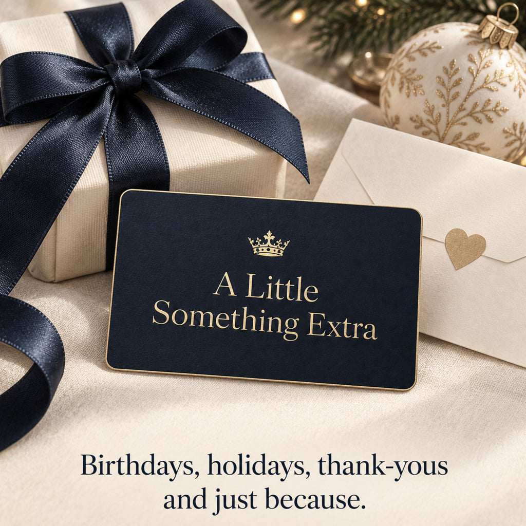 Navy and gold Zestful Productions gift card arranged with an ivory present tied in navy ribbon, a gold-accented holiday ornament and a cream envelope with a heart seal. The image suggests digital gifting for birthdays, holidays, thank-yous and just because.