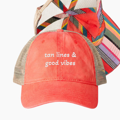 Tan lines and good vibes embroidered coral trucker hat with colorful striped underbrim detail