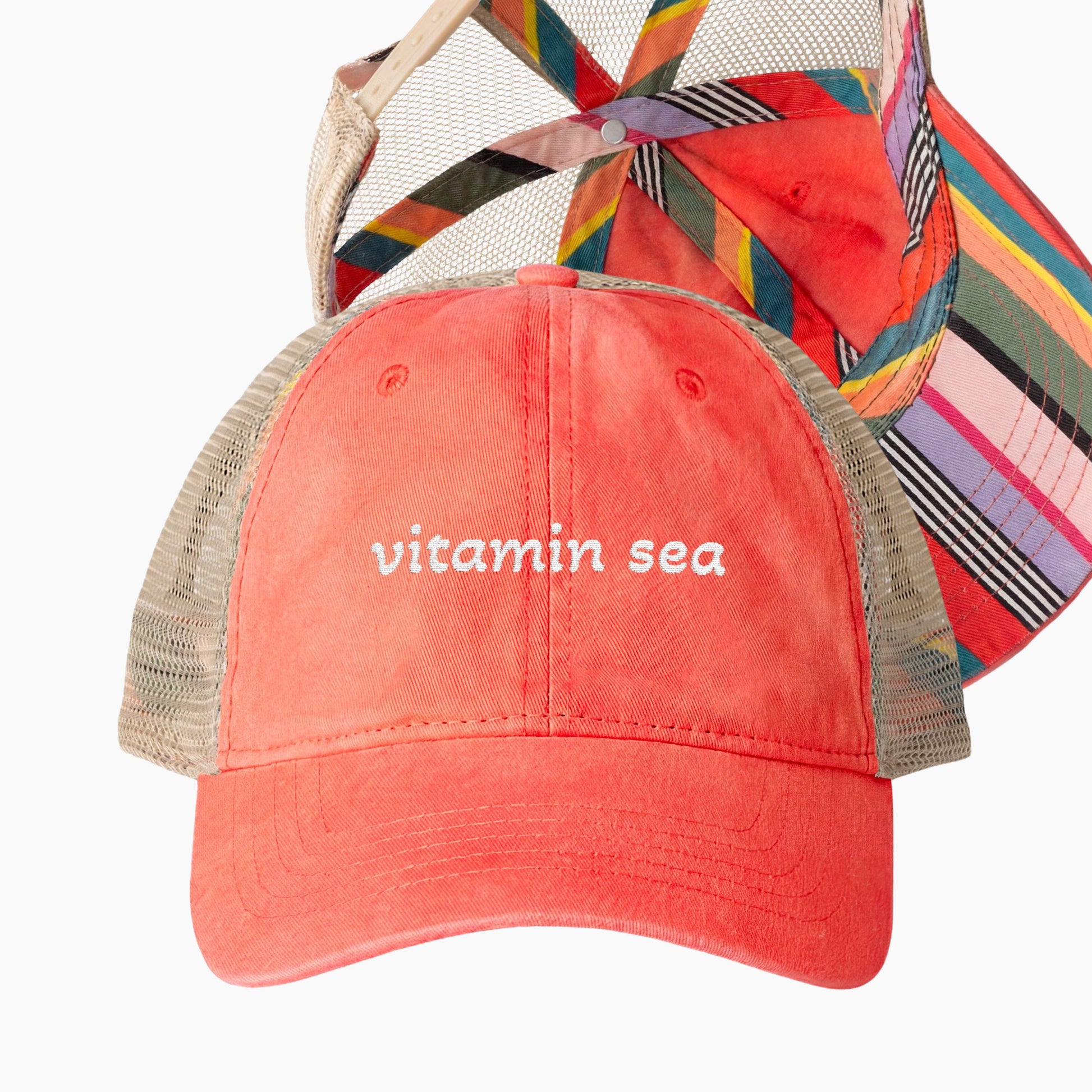 Vitamin sea embroidered coral trucker hat with beige mesh back and striped underbrim